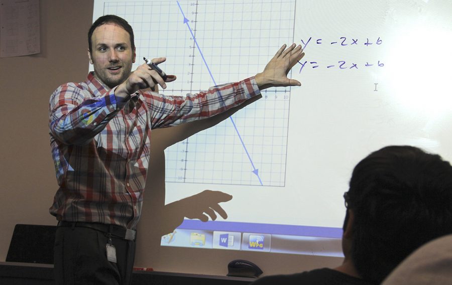 Mr. Jeffrey Brock explains Y slope intercept to his Algebra students.