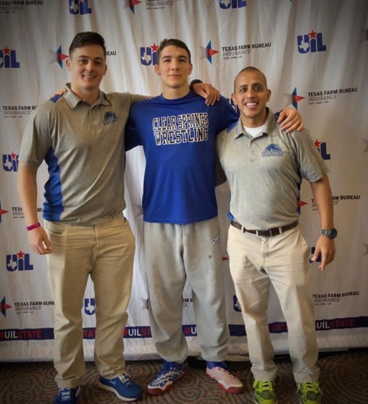 Kretzer is pictured with his coaches, Jaycob Freeman (left) and Michael Jimenez (right).