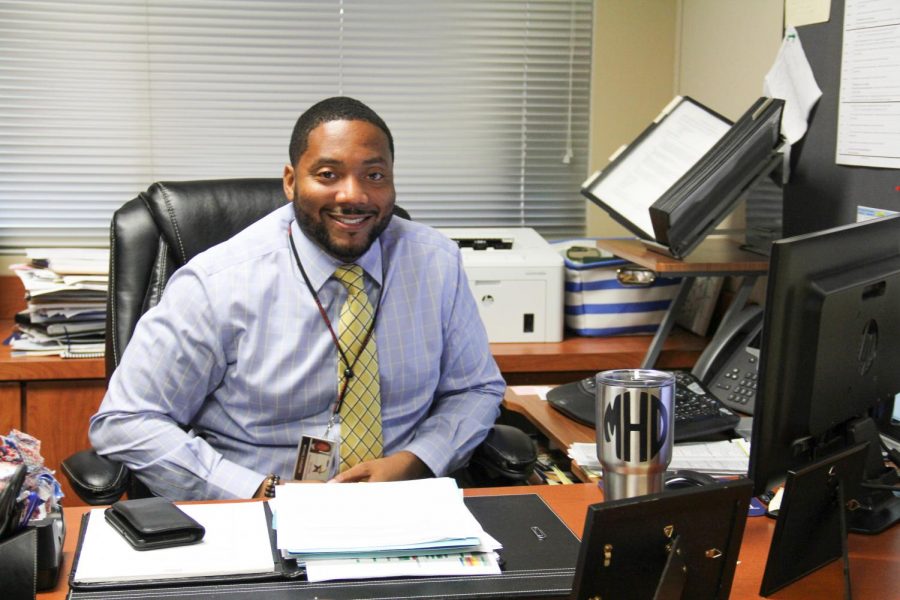 Mr. Michael Houston enjoying his new desk as principal.
