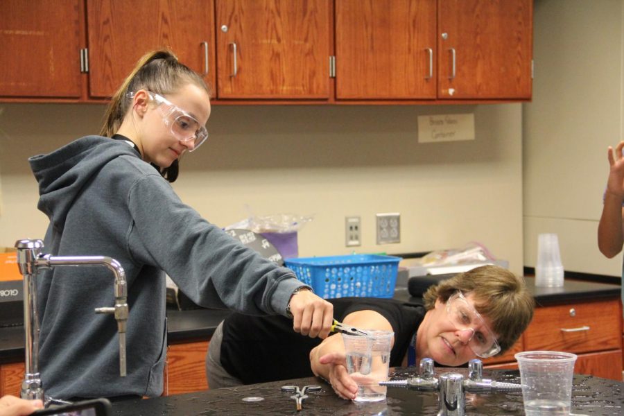 Dr. Hahns chemistry classes conduct a dry ice experiment.
