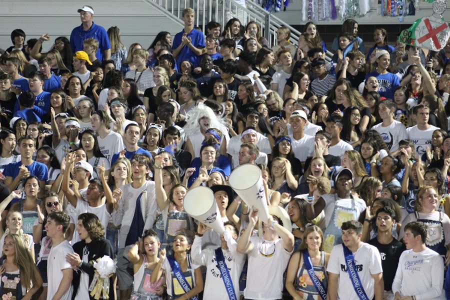 The+student+section+cheers+on+the+Varsity+Football+team+as+they+win+their+homecoming+game+against+Clear+Falls+on+Sept.+27th.