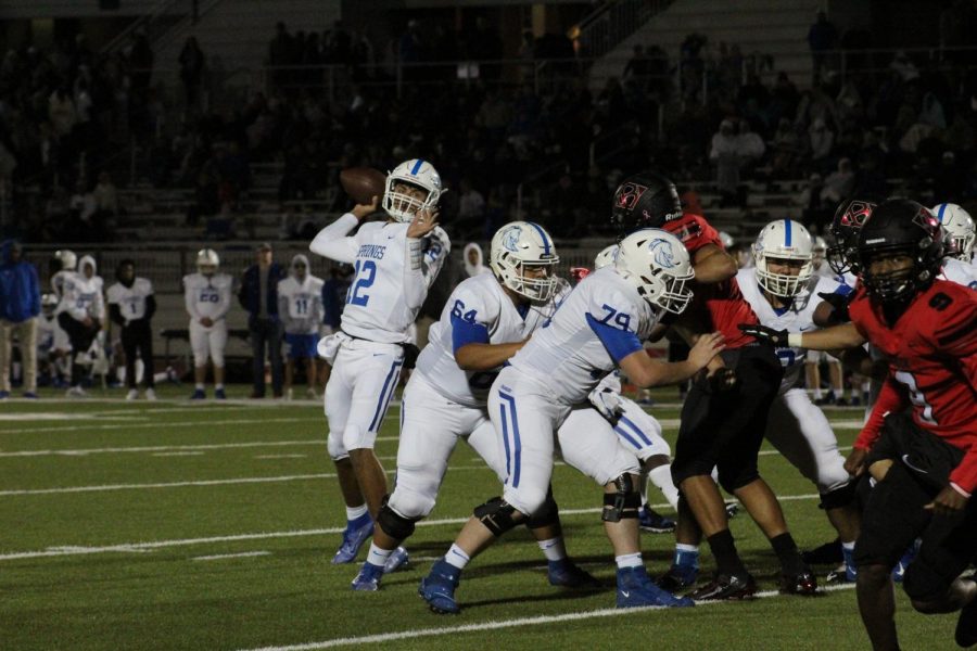 Quarterback Garrett Rooker targets a receiver downfield.