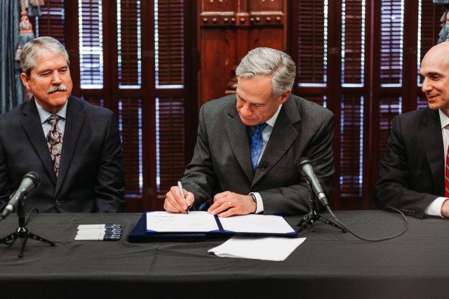 Governor Greg Abbott signing a bill